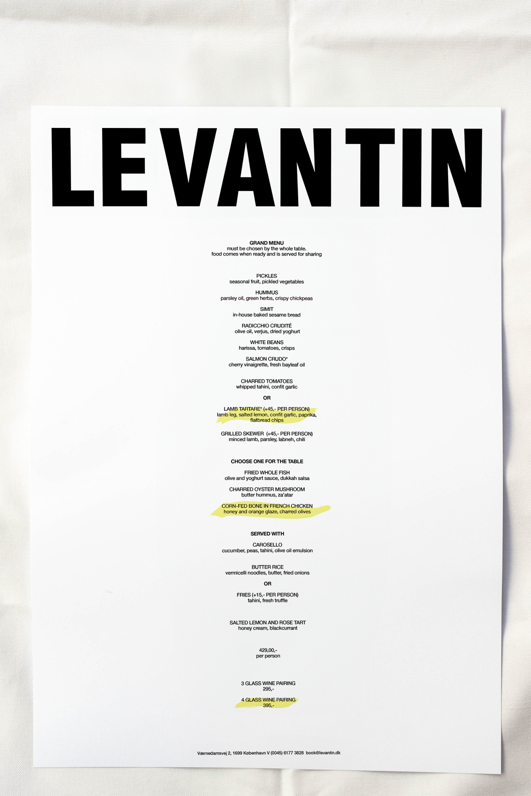 Image showcasing sharing menu at levantin. A picture of a menu placed on a patterned carpet.